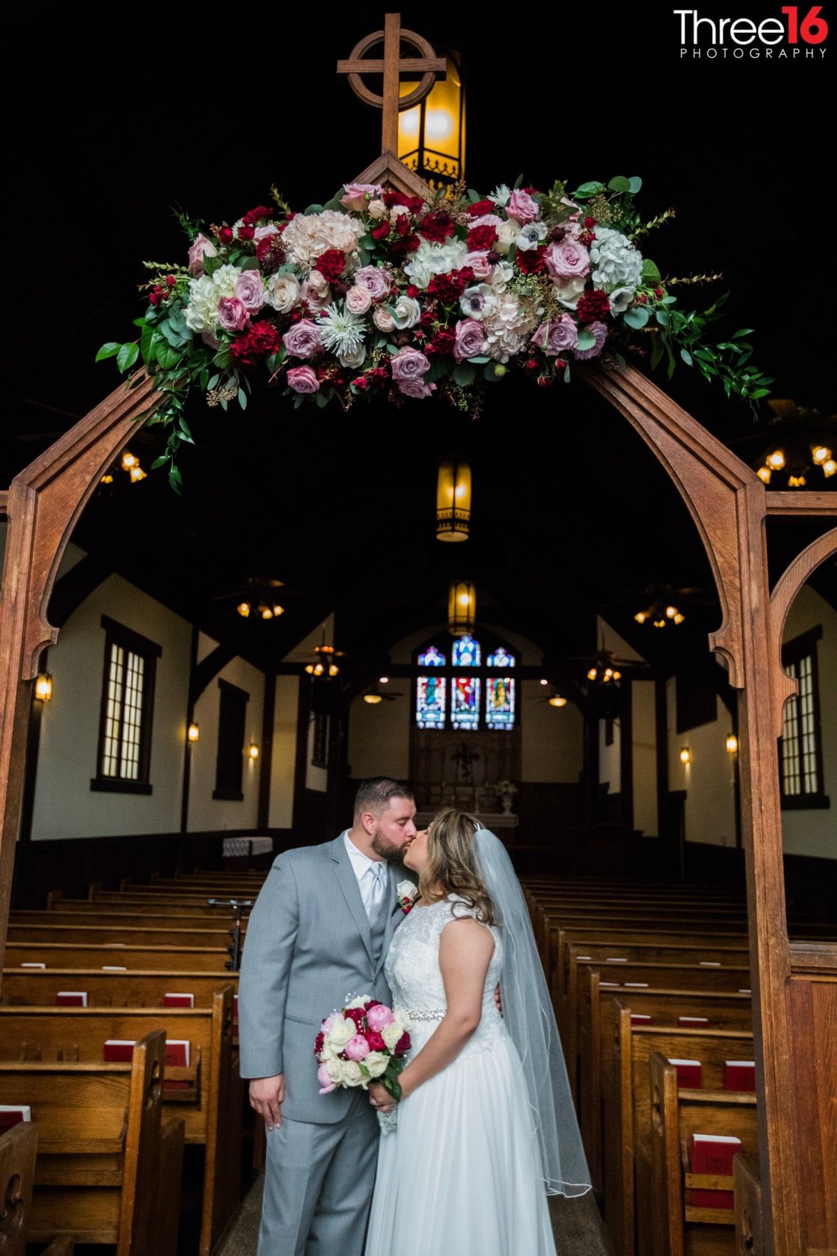 Bride and Groom share a kiss in the Chapel of Orange