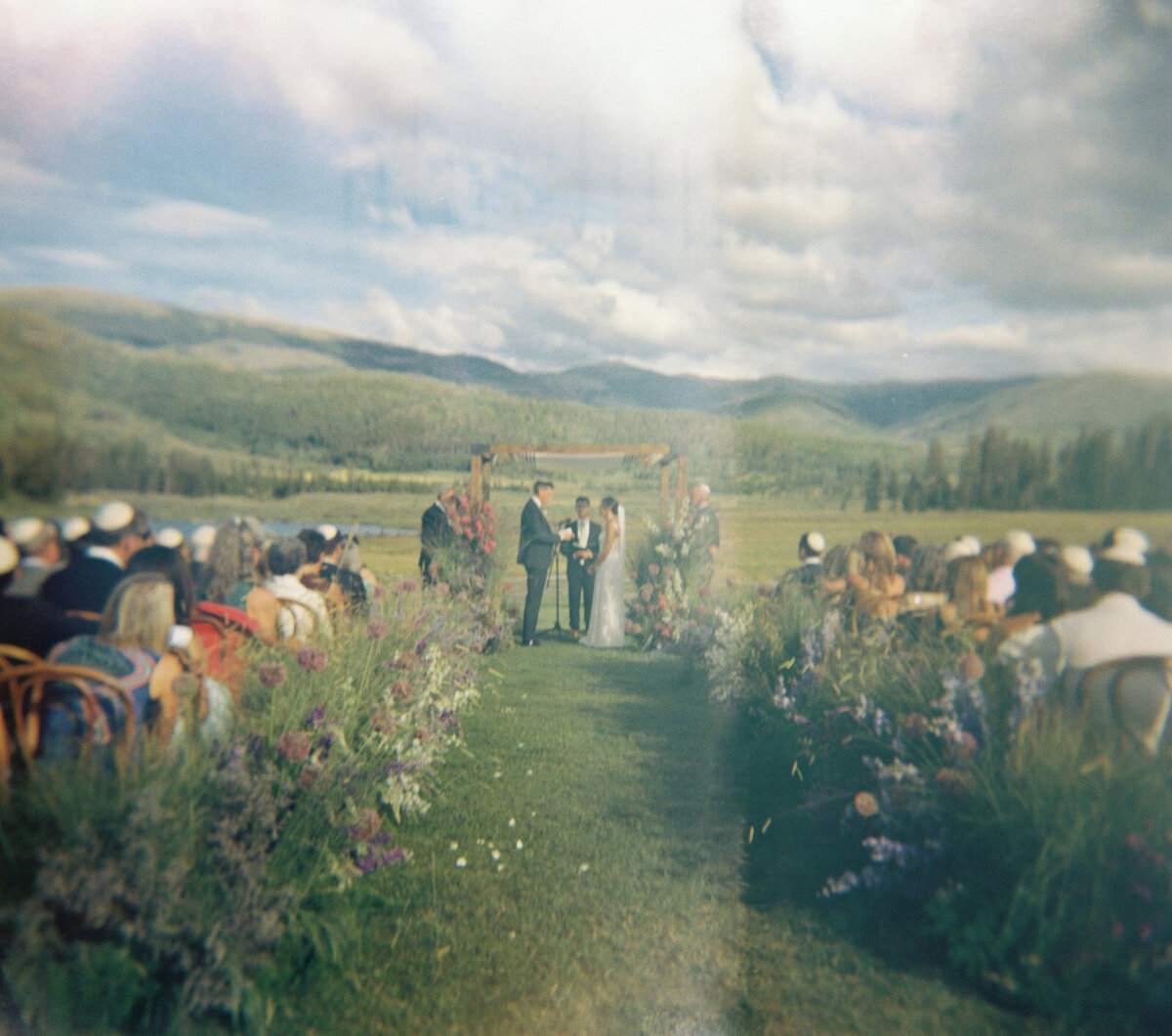wedding ceremony at Devil's Thumb Ranch in Colorado with Jenna Wren Photography 