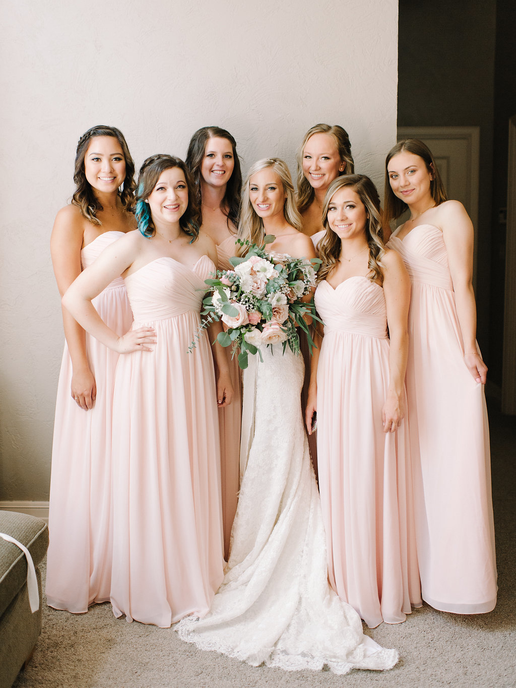 Beautiful bridesmaids in blush gowns.