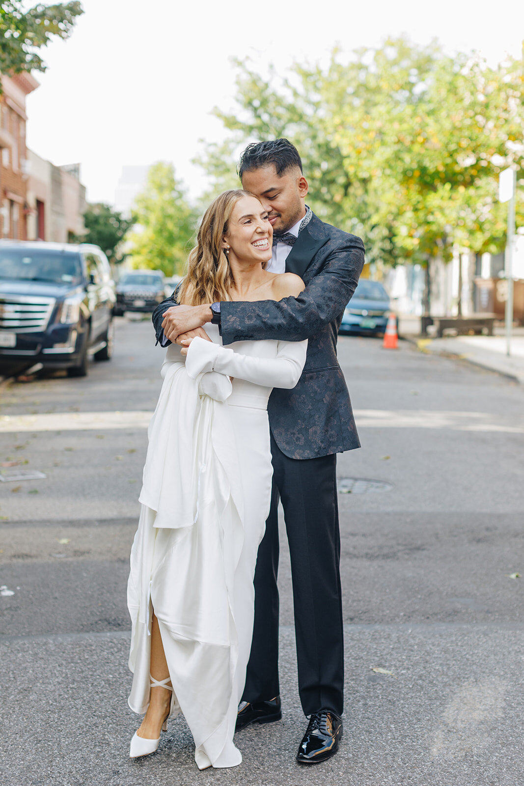 bride and groom dancing and laughing in nyc