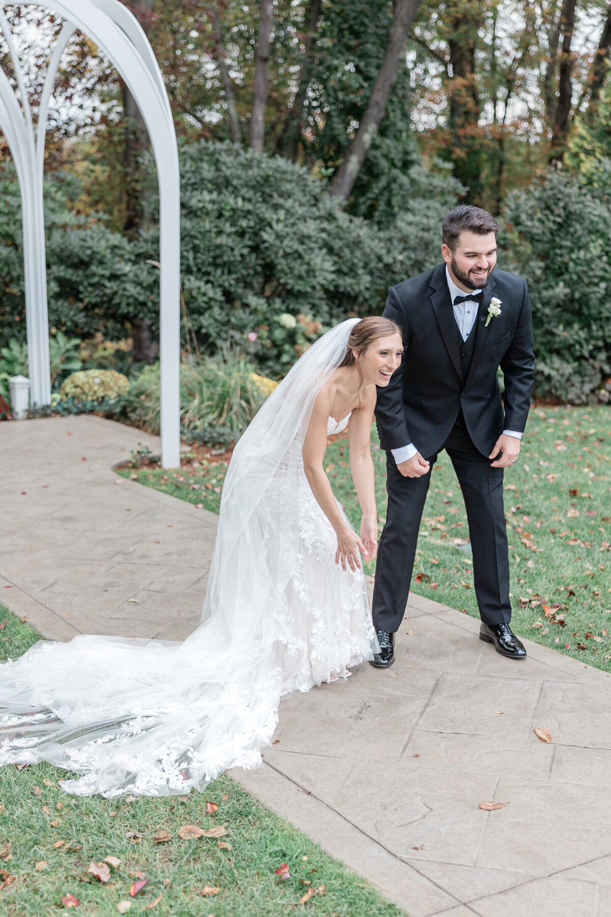 A bride and groom greet their beloved dog