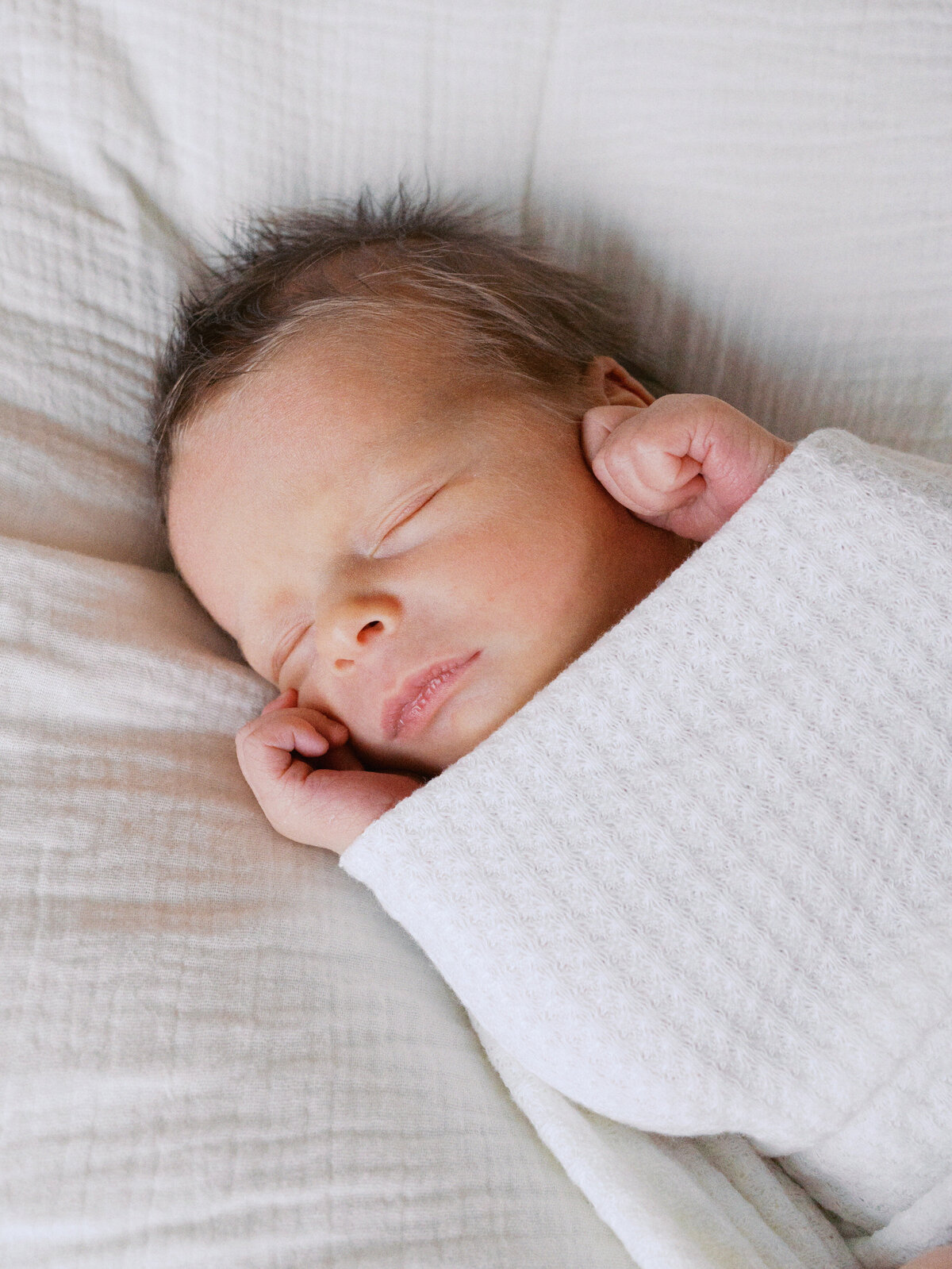 swaddled-newborn-all-white