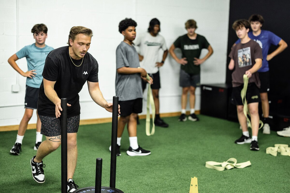 3 personal trainers standing in a row