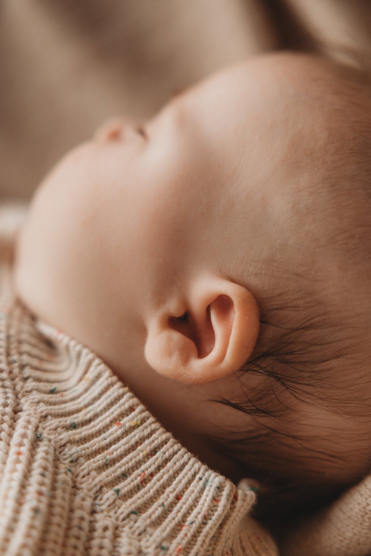 detail of ear of newborn baby captured by Bie in wanaka