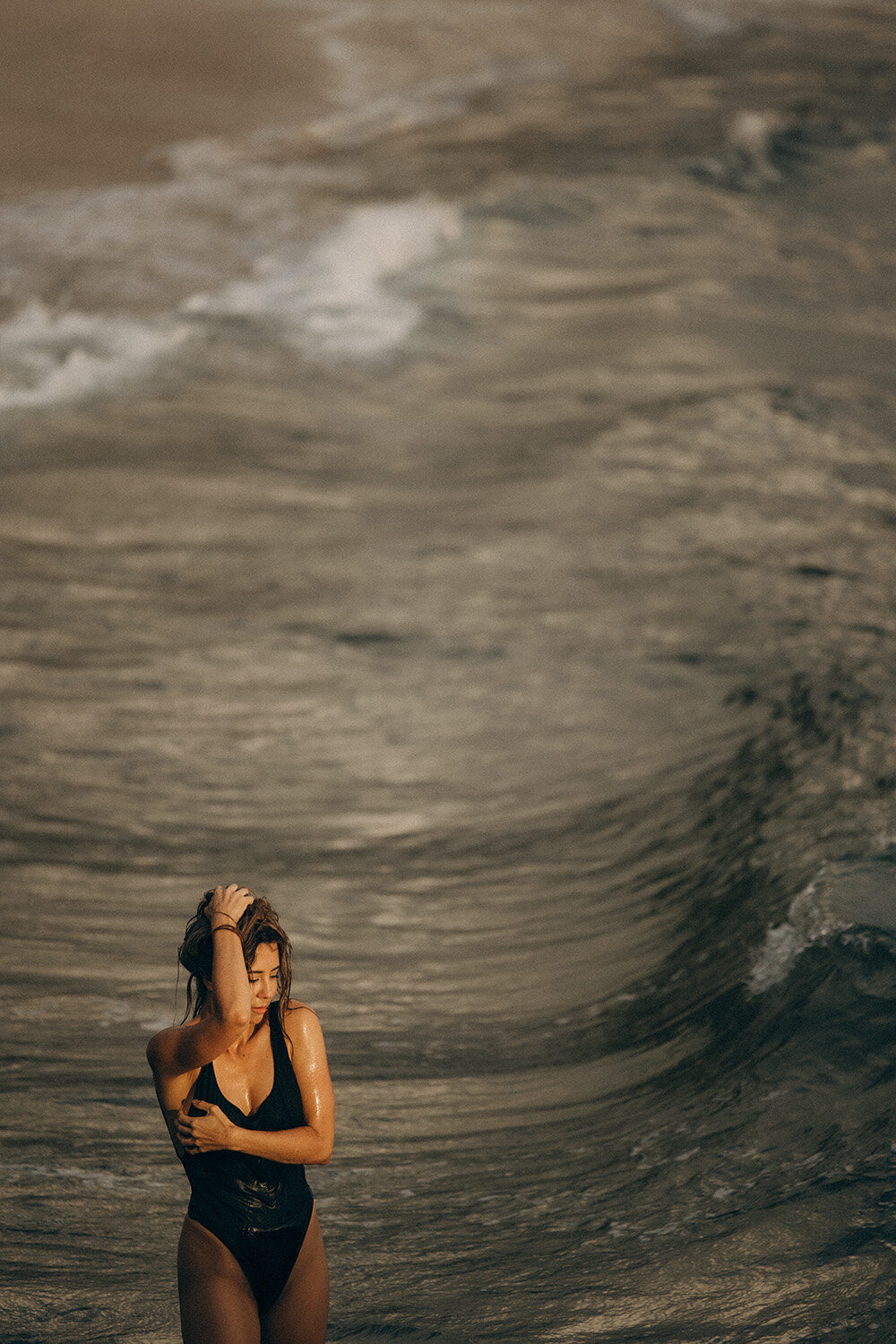 Sunshine Coast beach Swim Suit Brand Photographer with a model on the rocks.