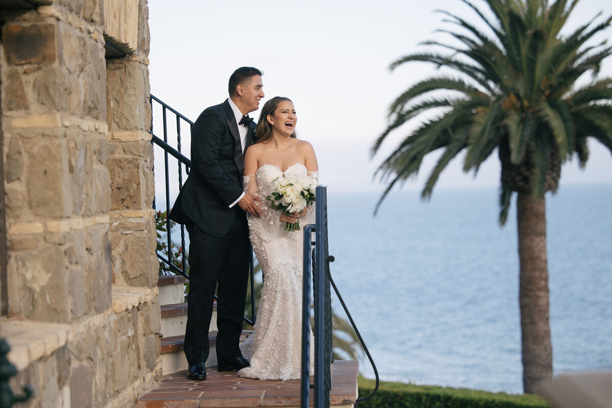 Latin couple standing on the stairs of bel Air Bay Club