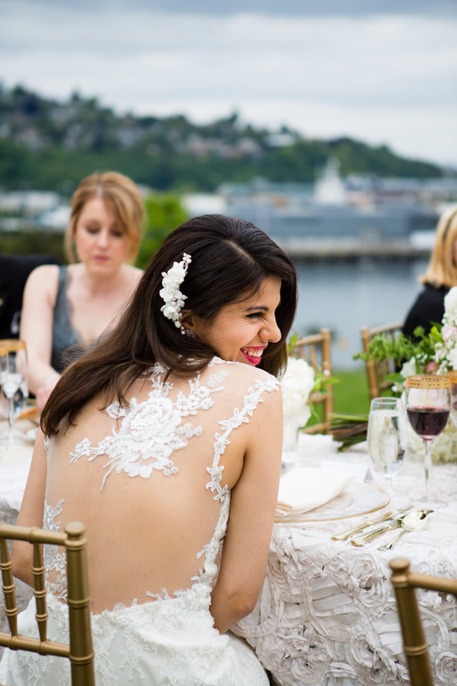 Caroline enjoying her outdoor garden wedding wearing a lovely embroidered wedding gown.