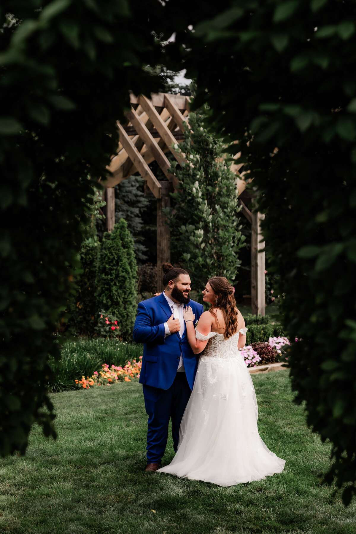 A couples photo through the trees at The Farmhouse in Plainfield.