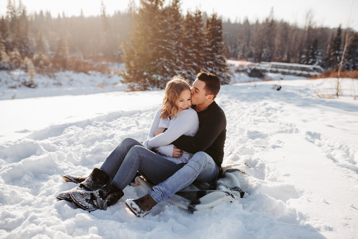 couple photos hugging in edmonton at macctaggart sanctuary