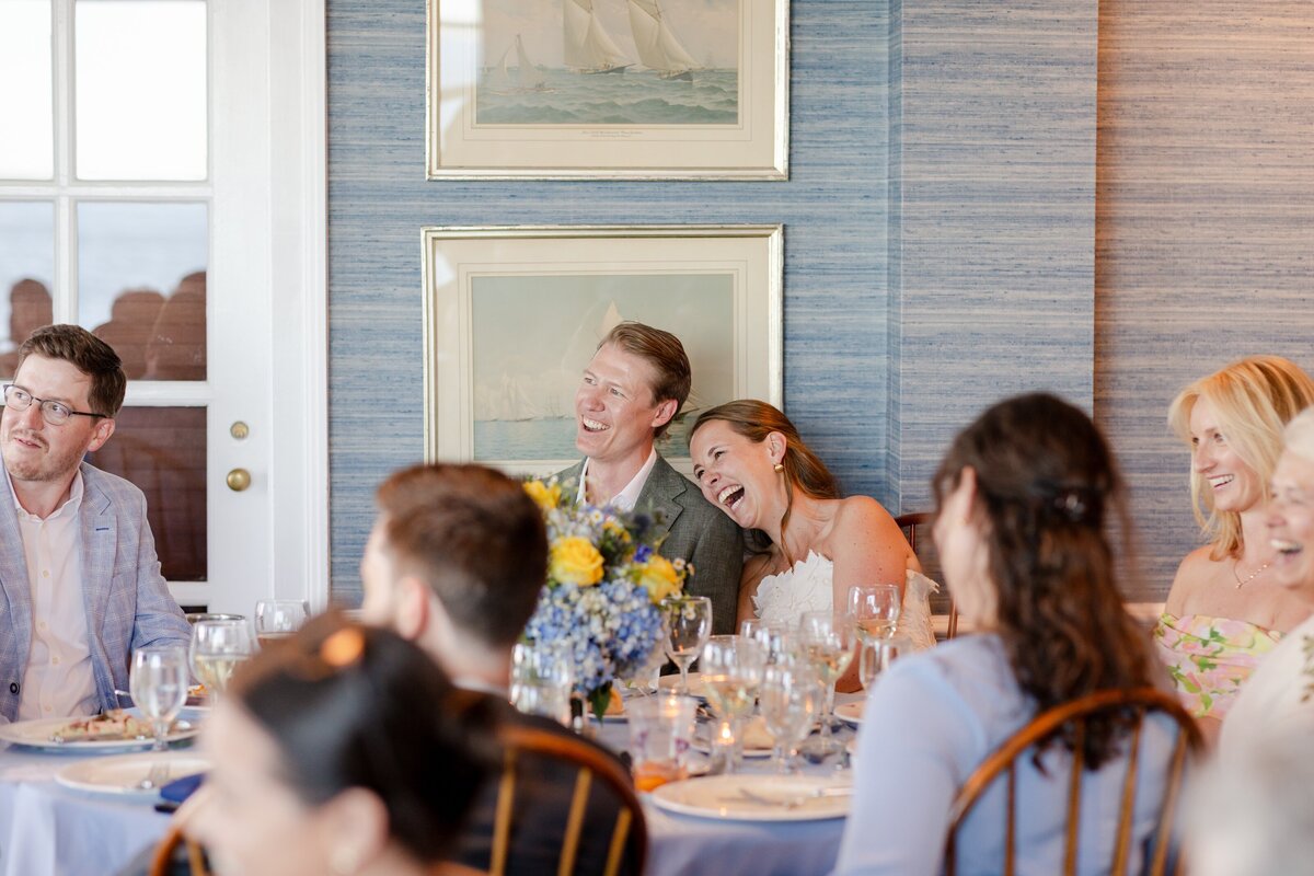 couple laughing during speeches