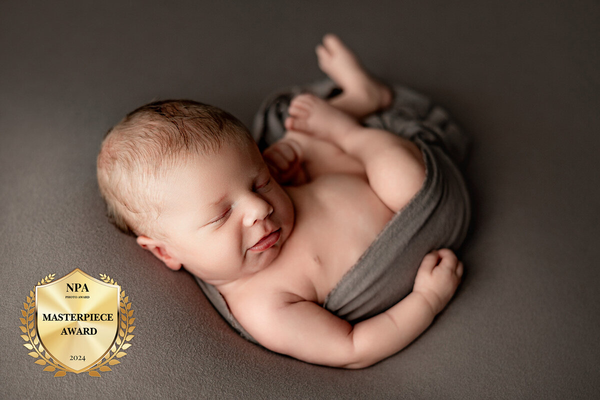 infant in a relaxed pose in photography studio in charlevoix