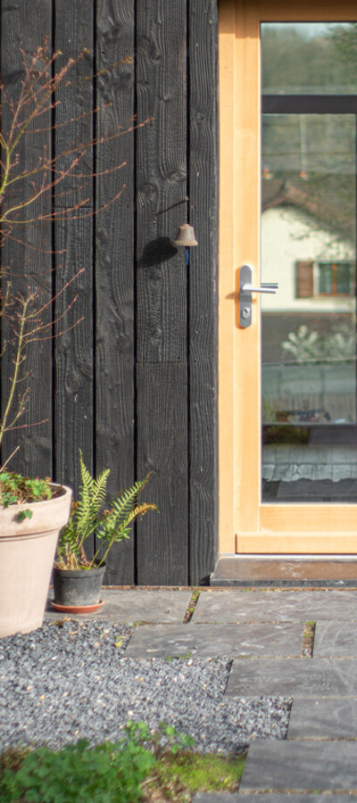 Light Wood Door with Shou Sugi Ban Siding