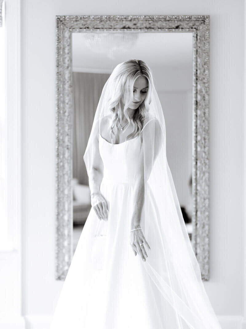 Bride in front of mirror by chicago wedding planners
