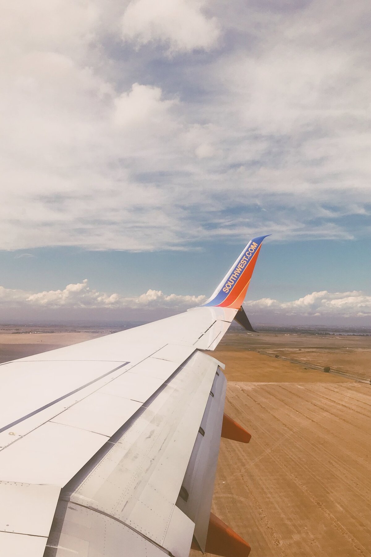 Airplane-Wing-Over-Landscape-Flight-View