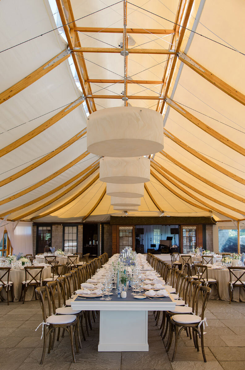 Castle Hill Inn tent with view of long table set up