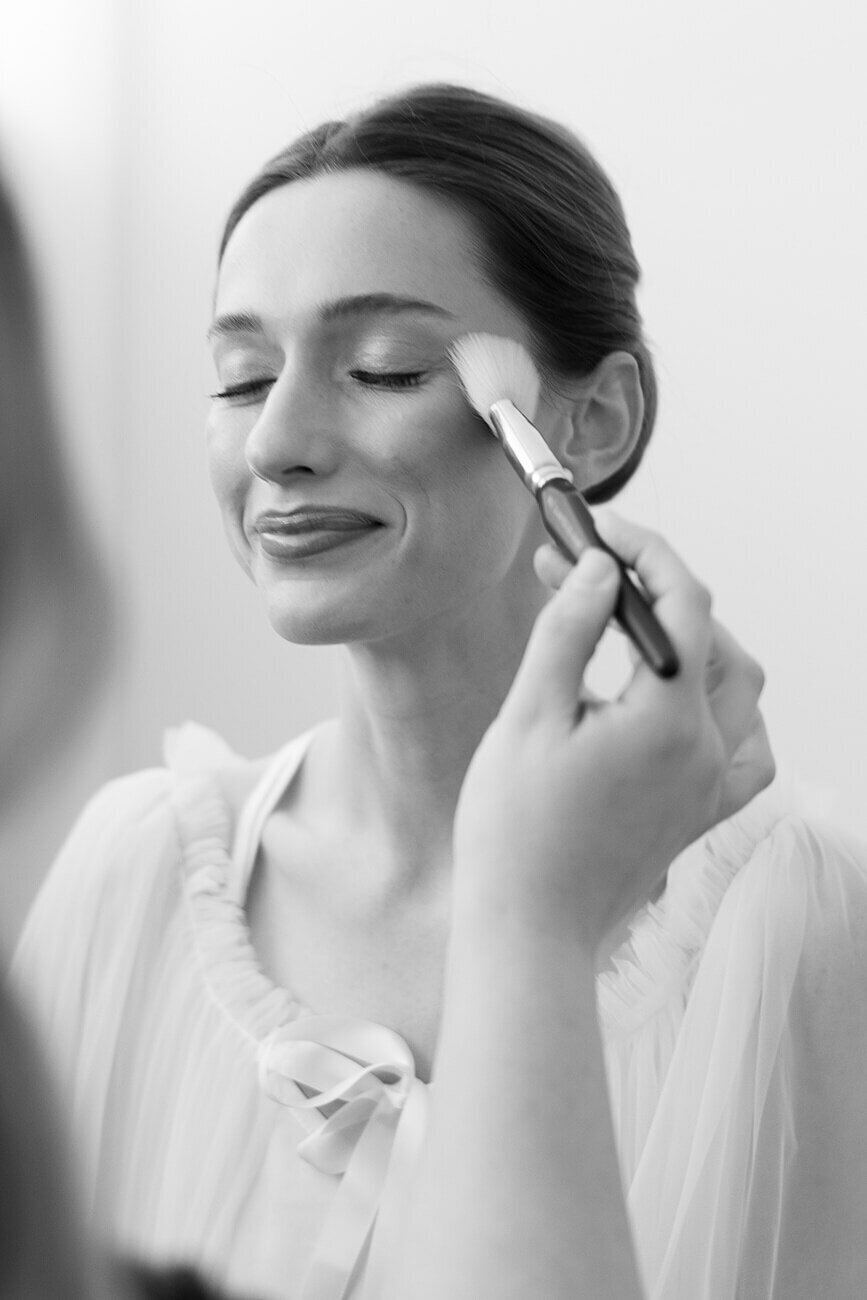 bride getting make up done