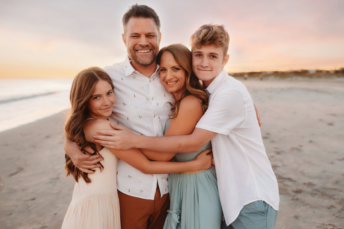 Family embraces during Family Pictures in Isle of Palms.