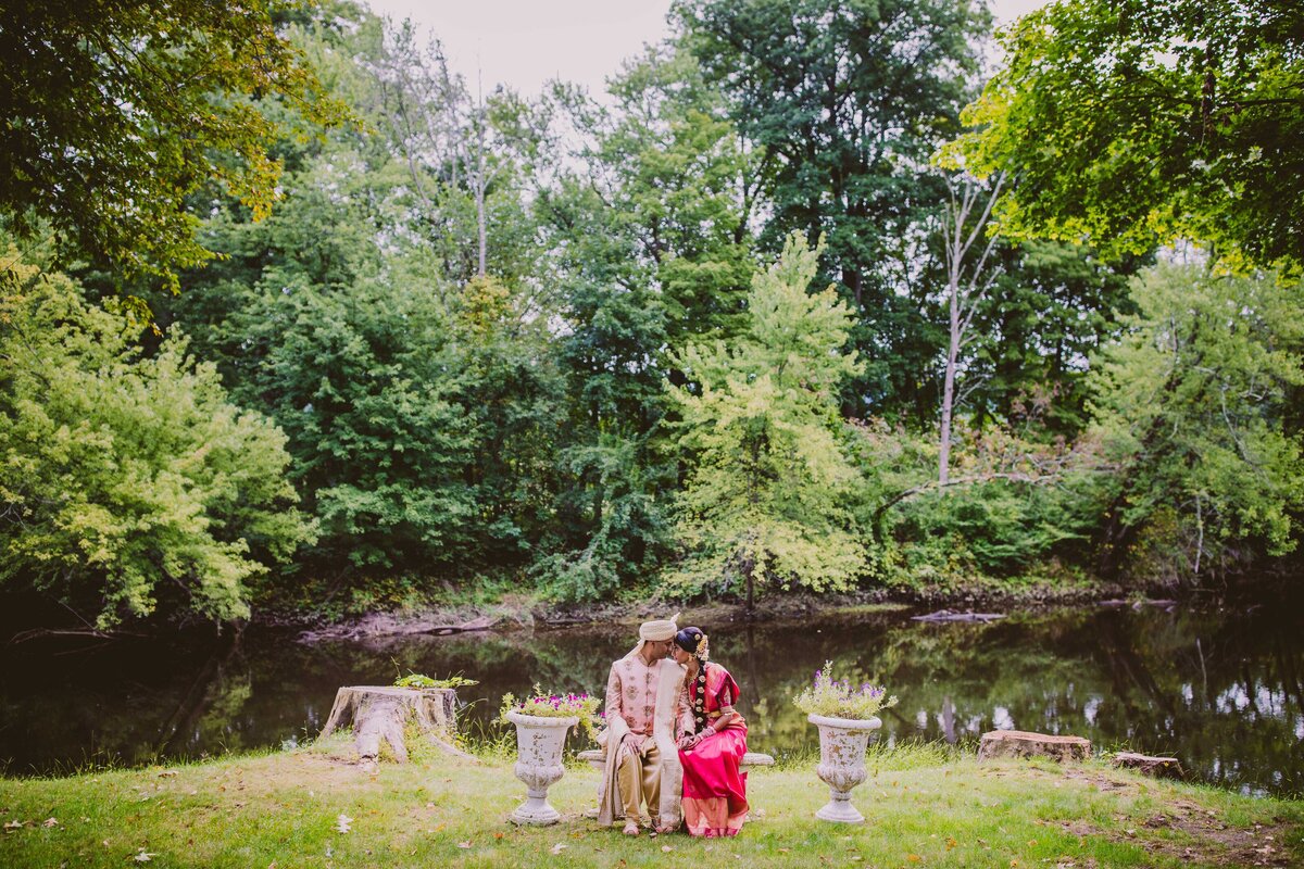 Indian telegu bride and groom sit together before the wedding ceremony at the Riverview in Simsbury CT