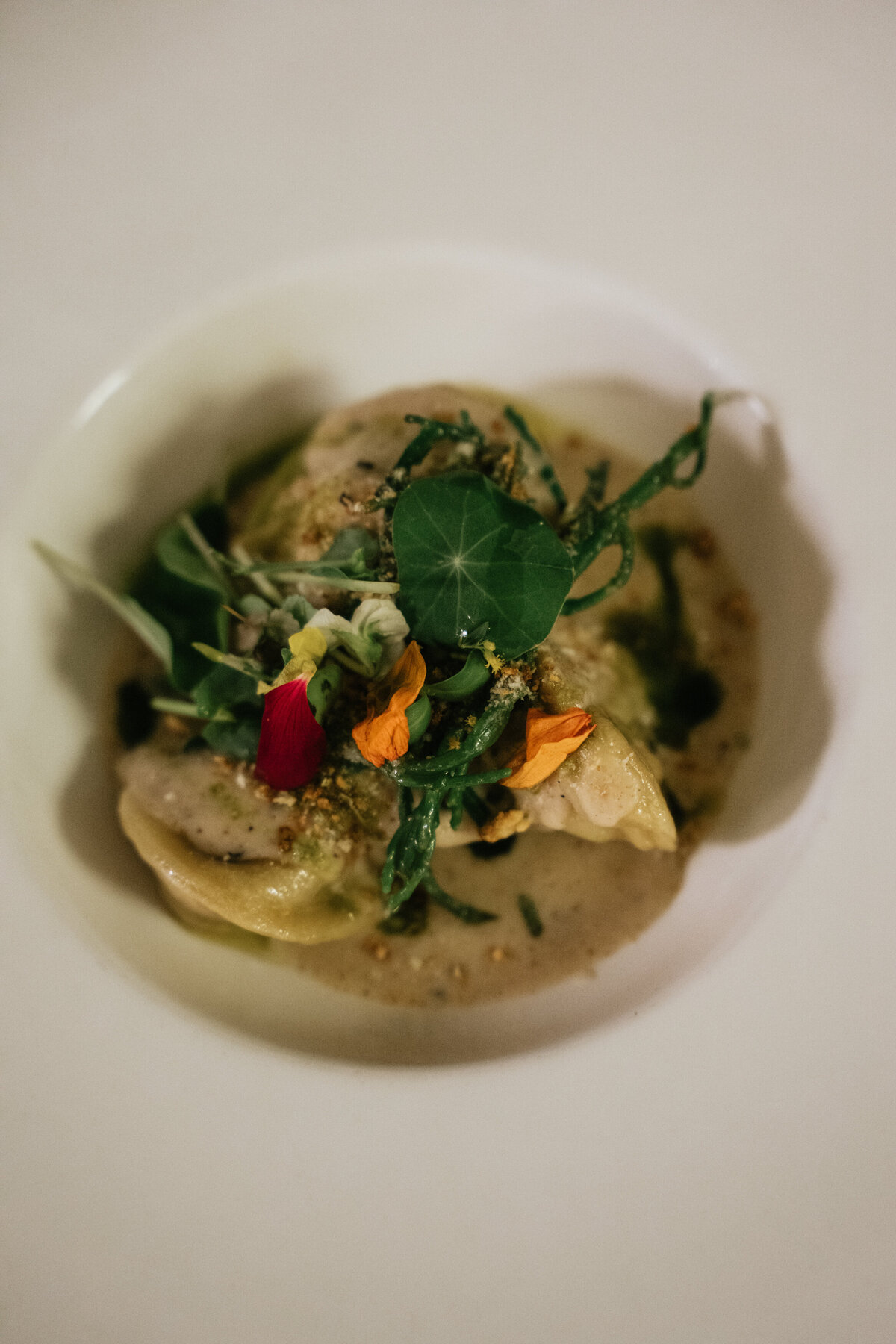 Vegan plated dish with autumn leaf garnish