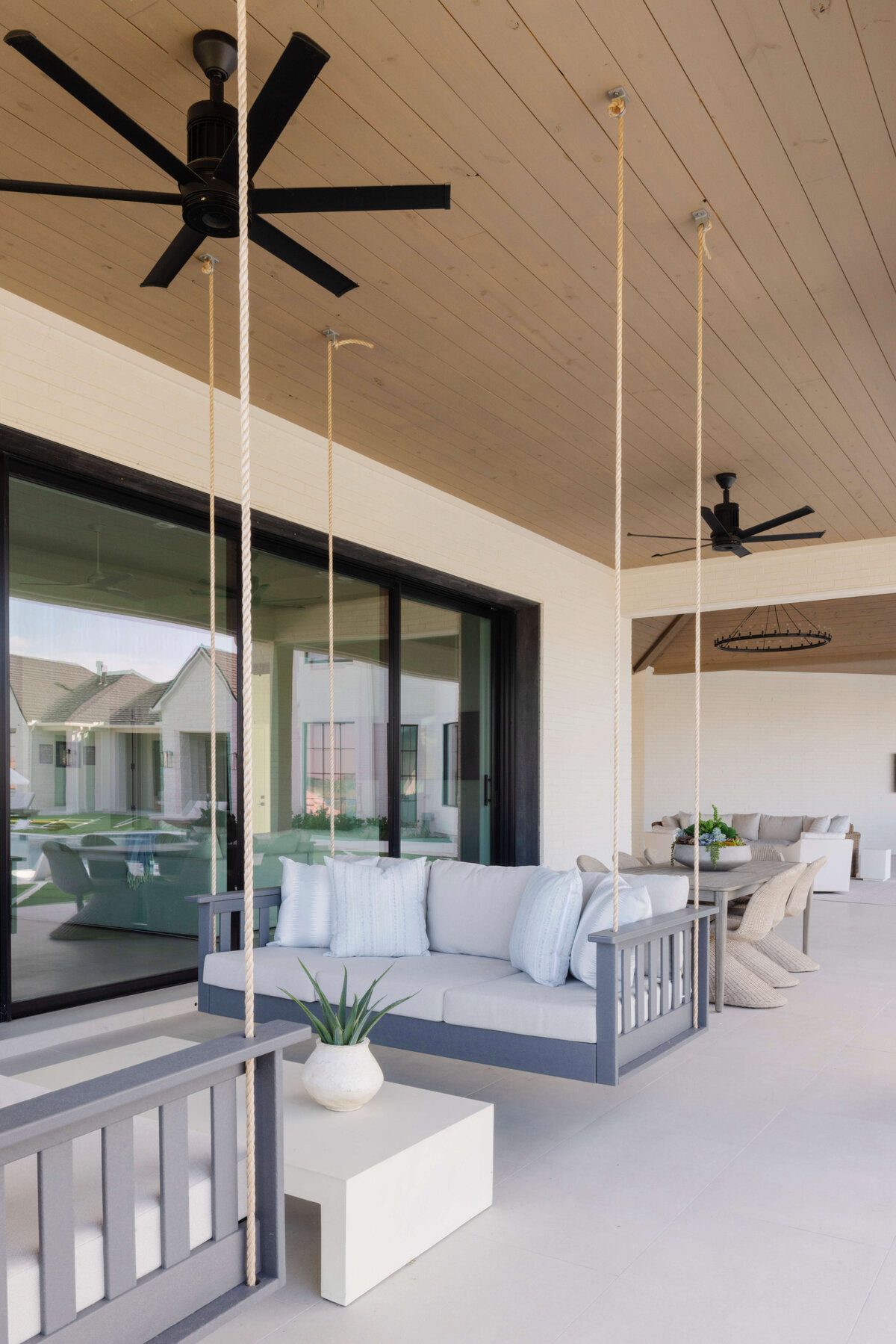 oyster creek studios hughes outdoor seating with black fans