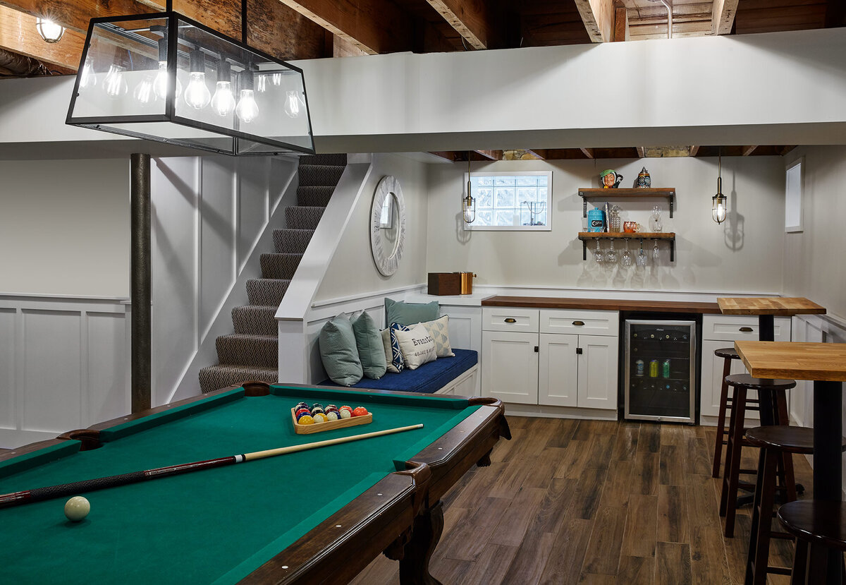 Modern basement design with hardwood floors and a pool table