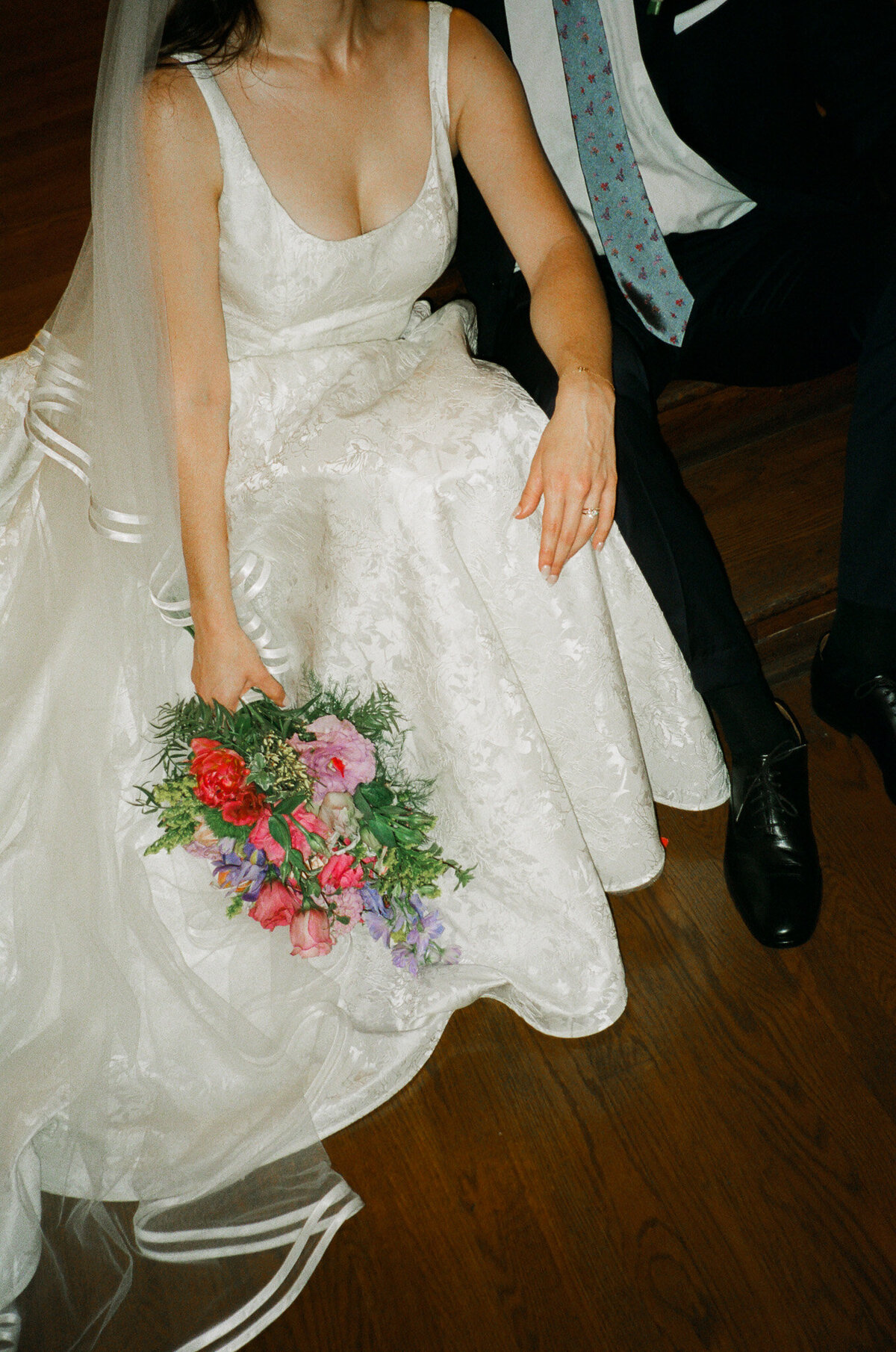 documentary photograph of a bride and groom with her bouquet, captured by Los Angeles documentary wedding photographer
