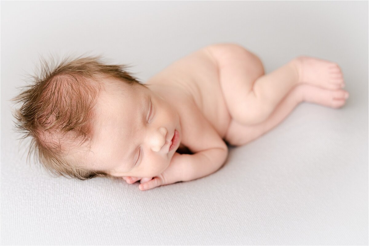 baby boy sleeping during newborn photography session