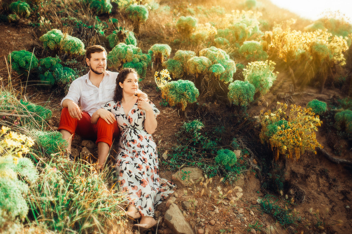 Engagement Photograph Of  Man And Woman Seated On The Ground Los Angeles