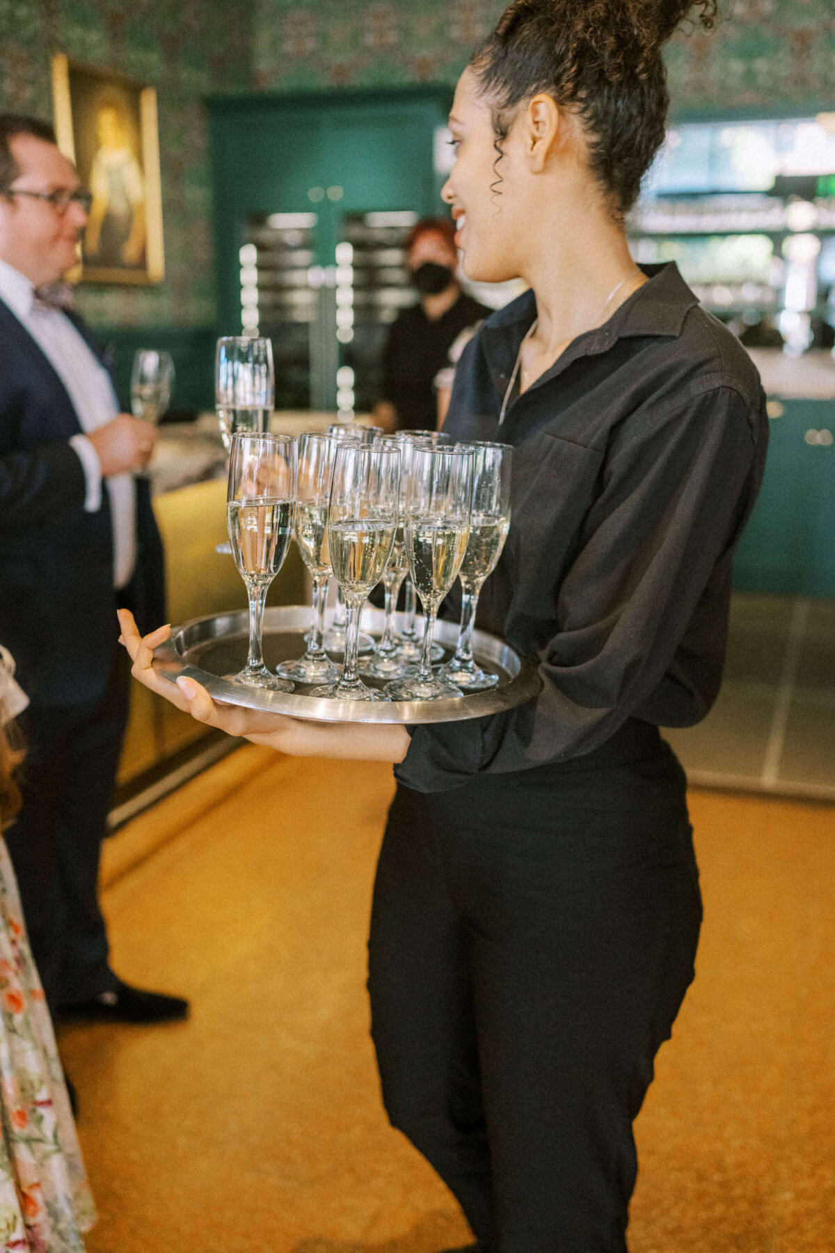 server-with-tray-of-champagne