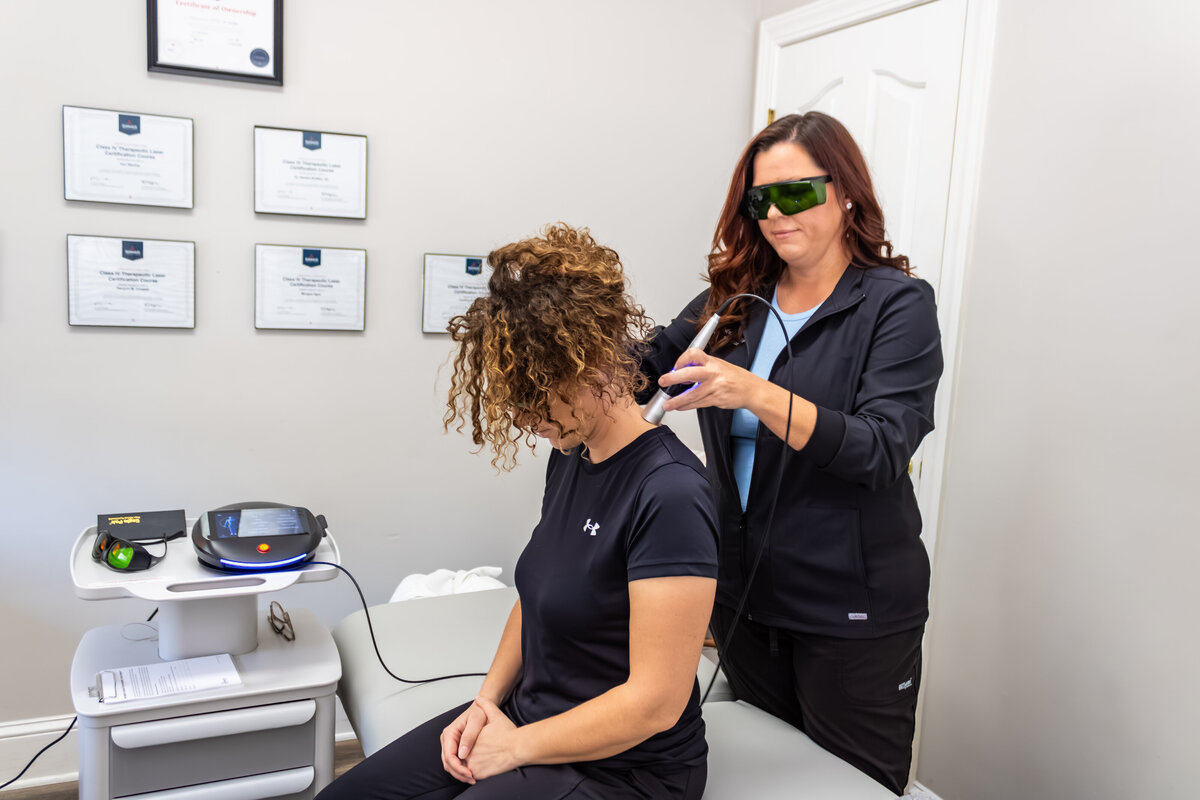 Dr. Buffkin performing laser therapy