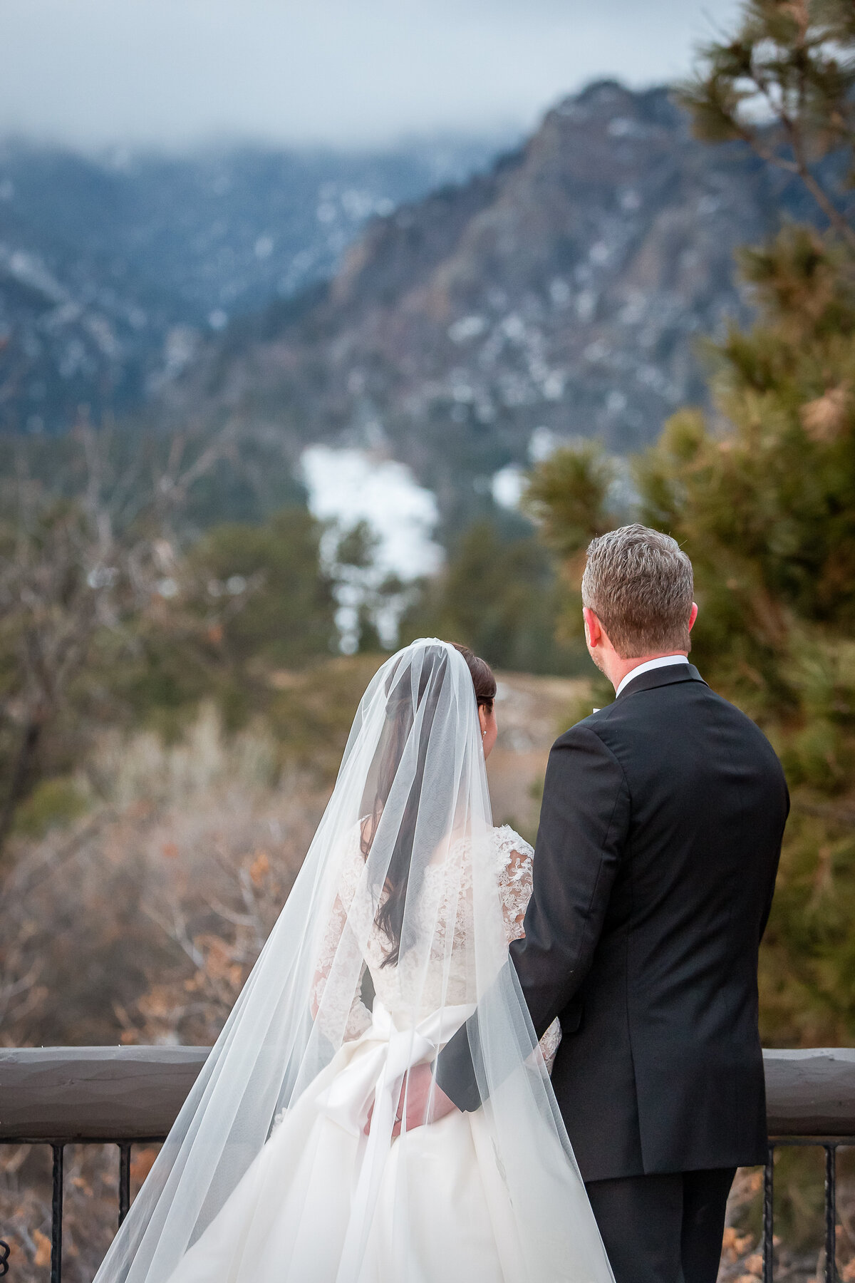 Bride and Groom Look at the View at the Cheyenne Mountain Lodge