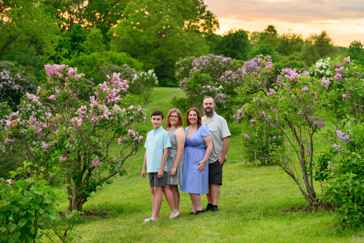 Amanda Gibson and her family in the lilacs