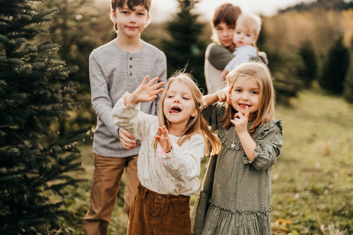 five-kids-making-faces-near-trees-being-silly
