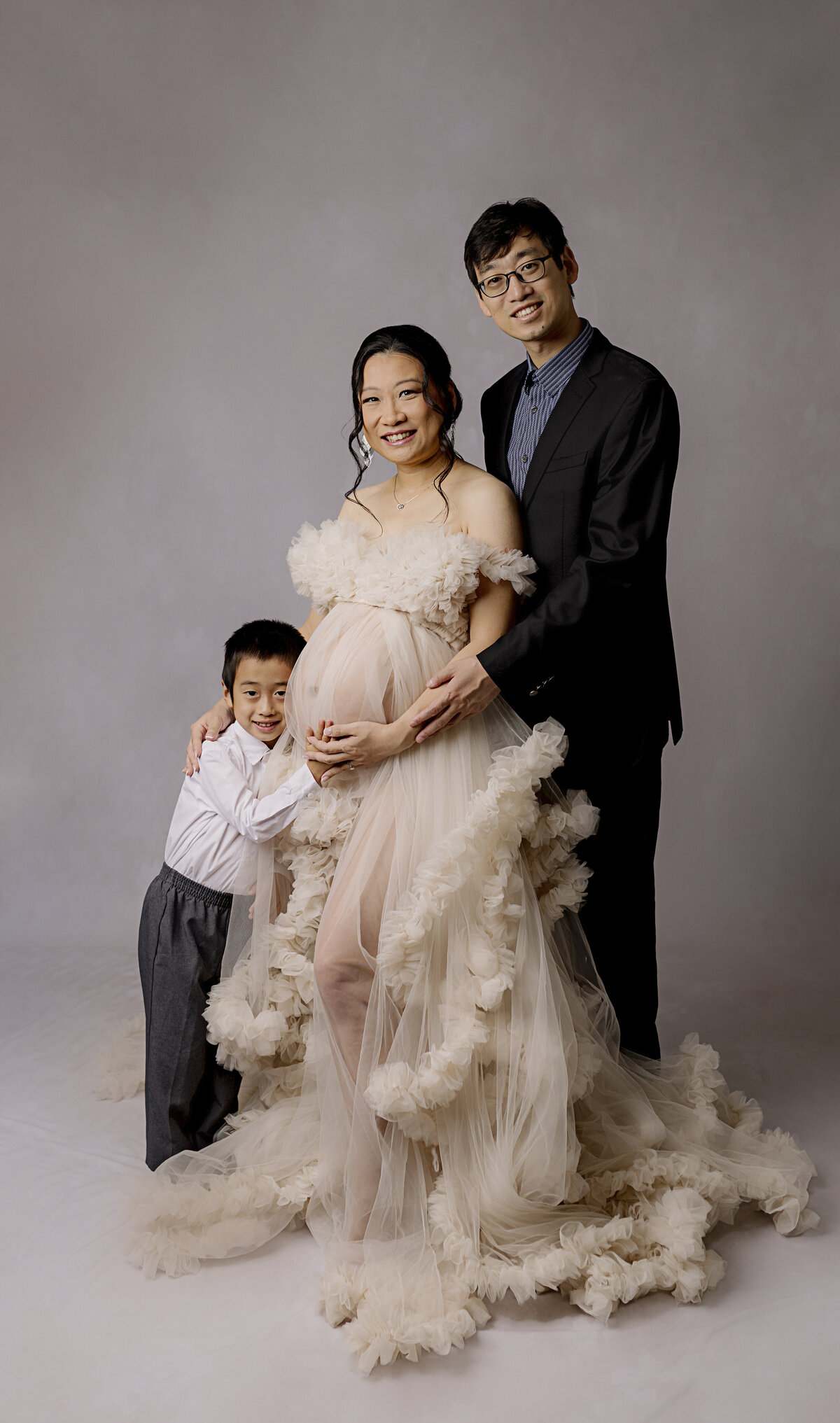 maternity family session smiling at camera