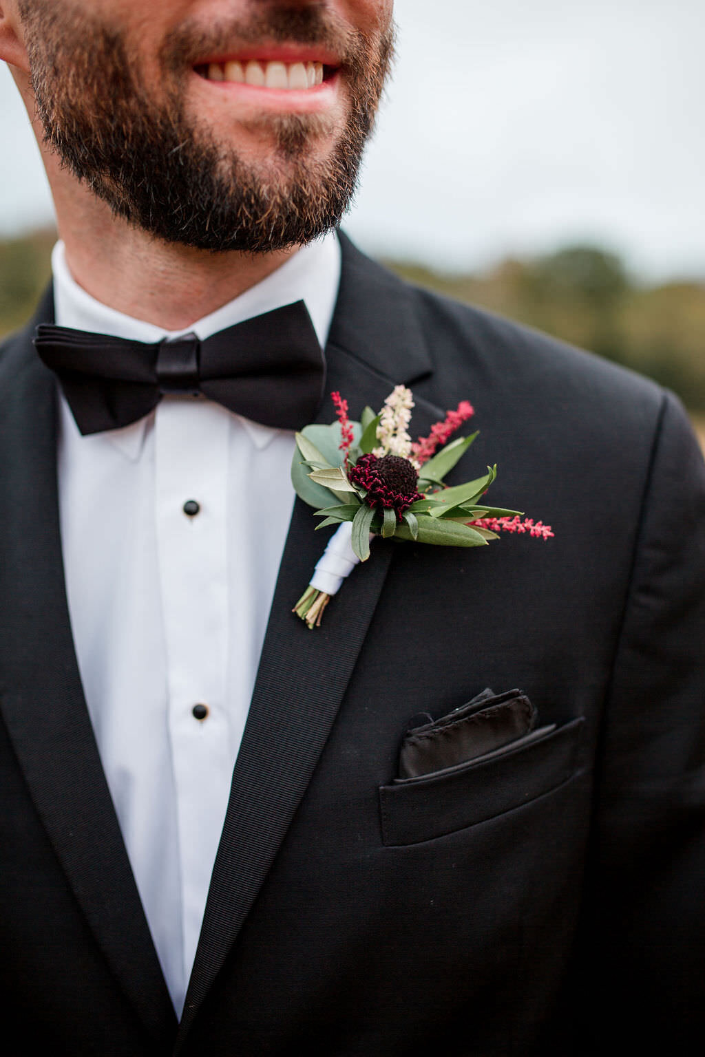 Grooms boutonniere at birchwood in burgundy and blush