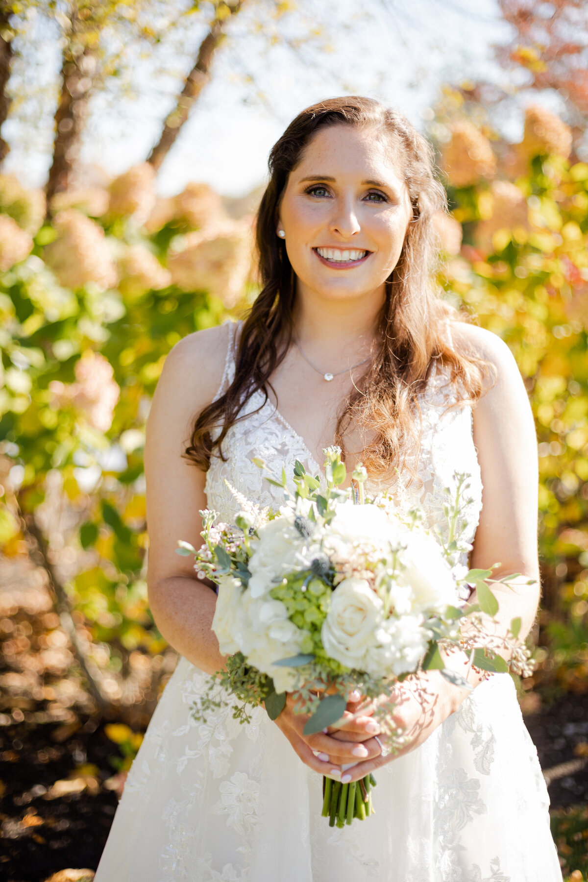Bridal portrait with a bouquet of flowers on her wedding day.