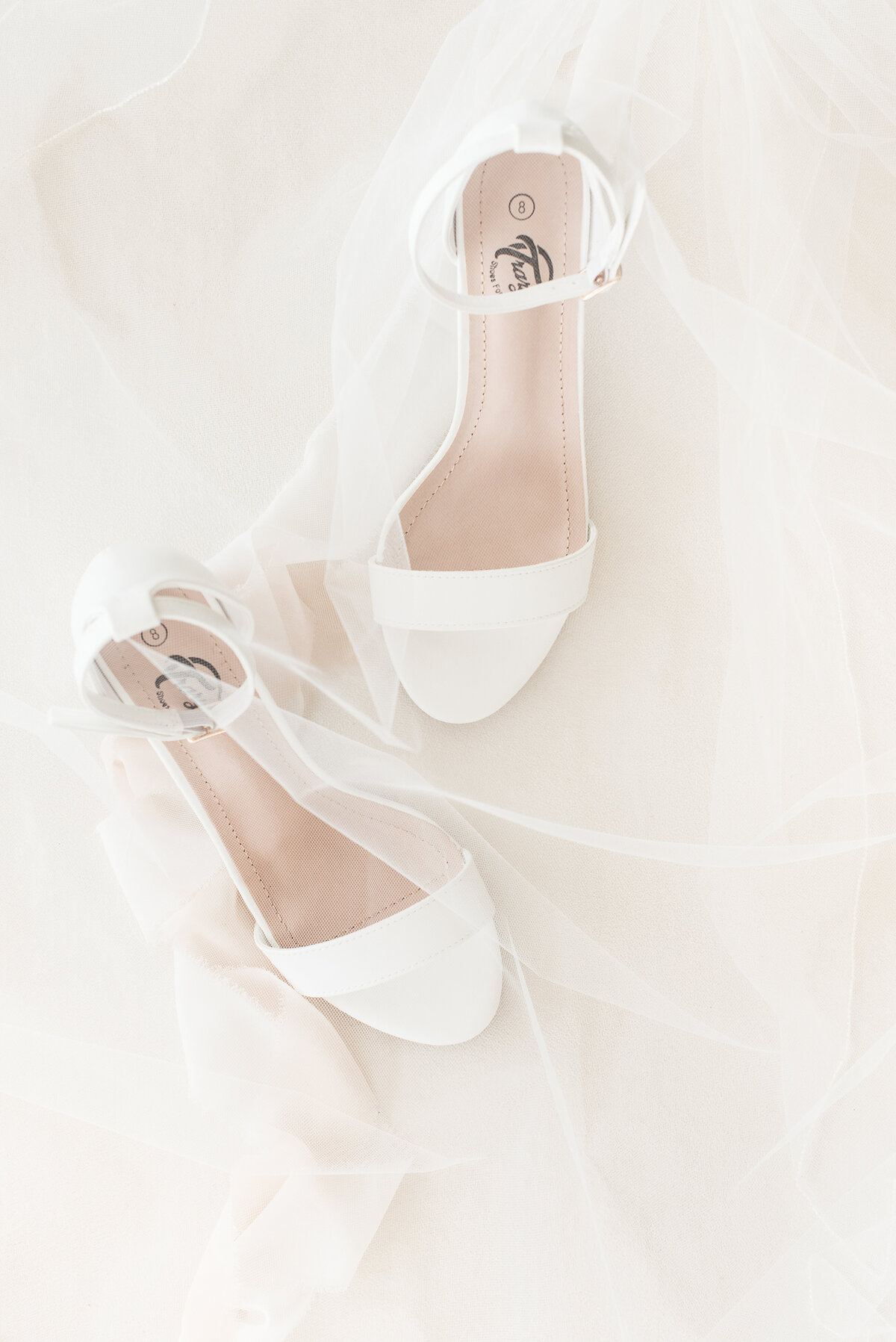 white wedding shoes and veil