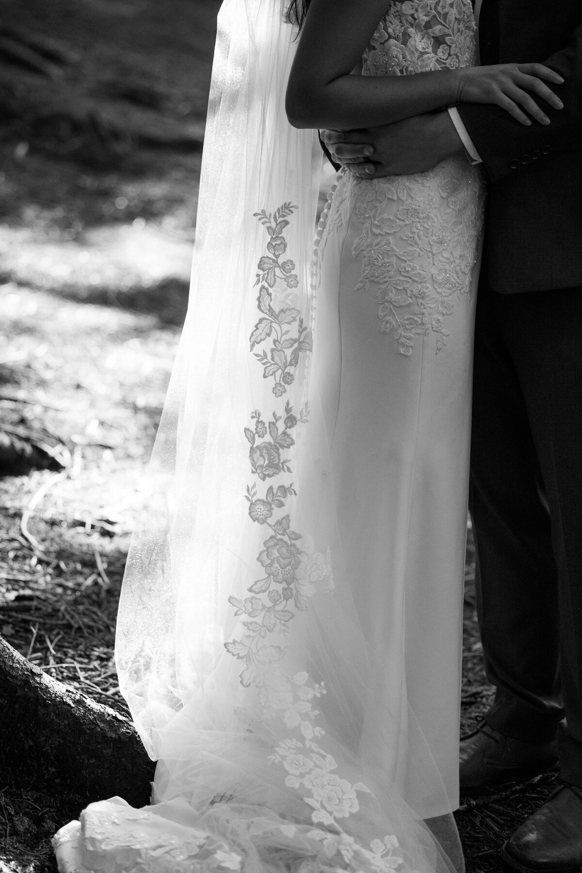 sunlight shines through a beautiful veil during a forest elopement in nc