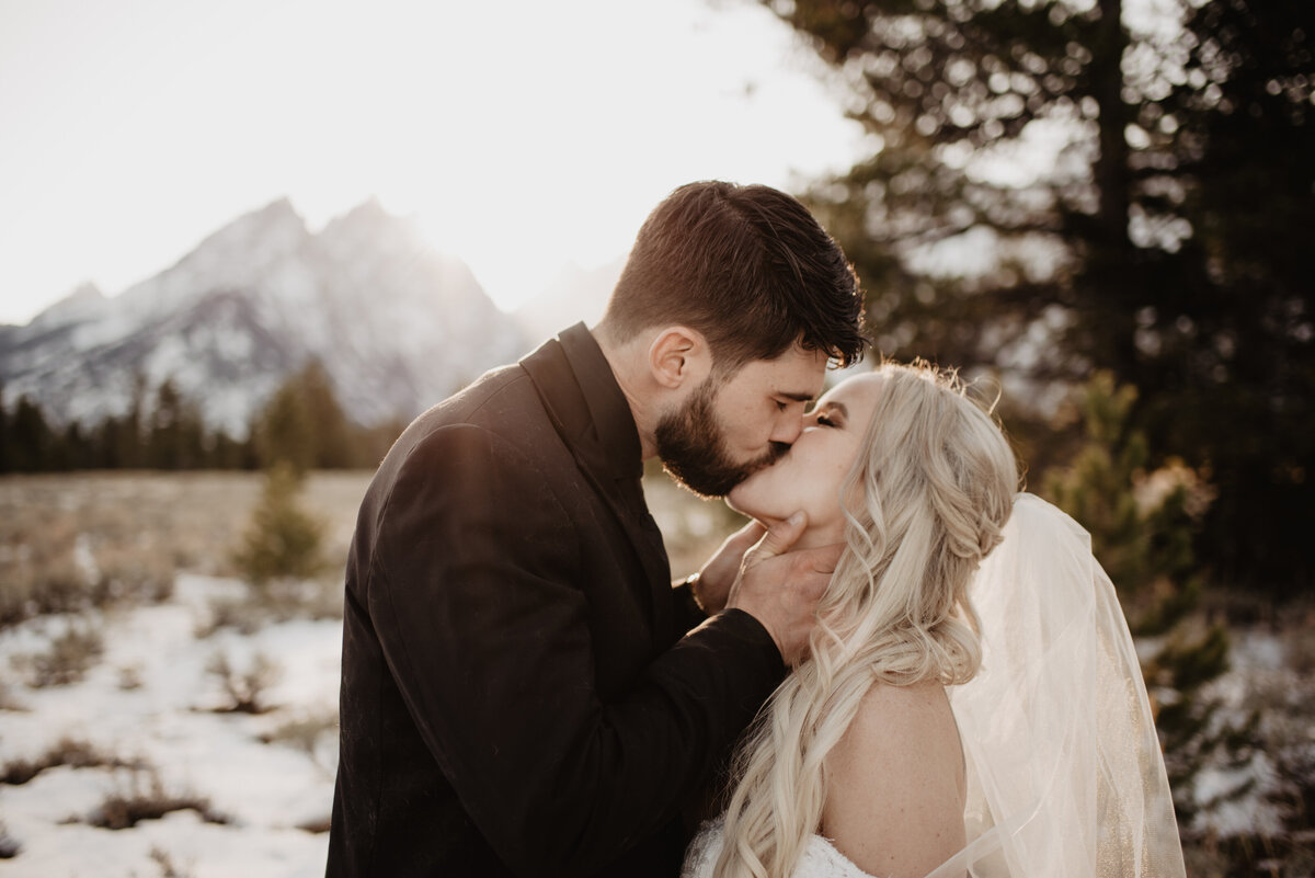 Jackson Hole Photographers capture couple kissing in front of Tetons