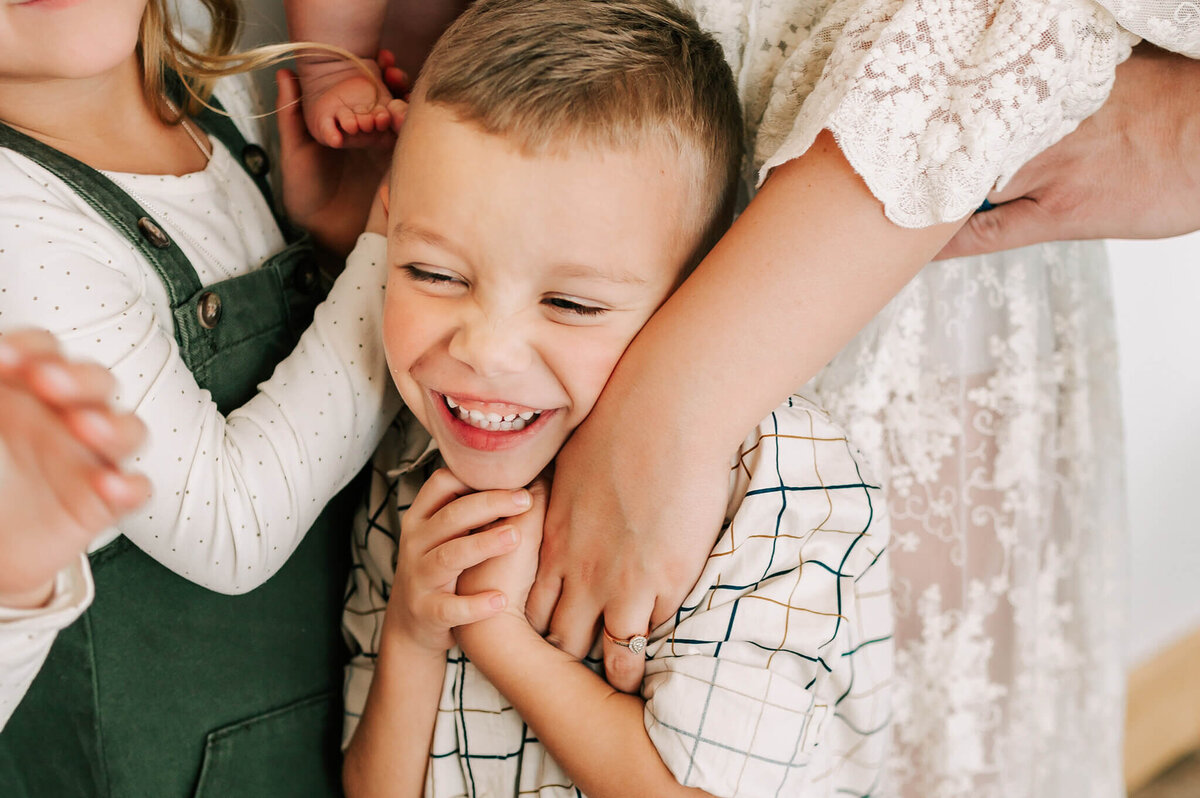 boy laughing enjoying Springfield MO family photography