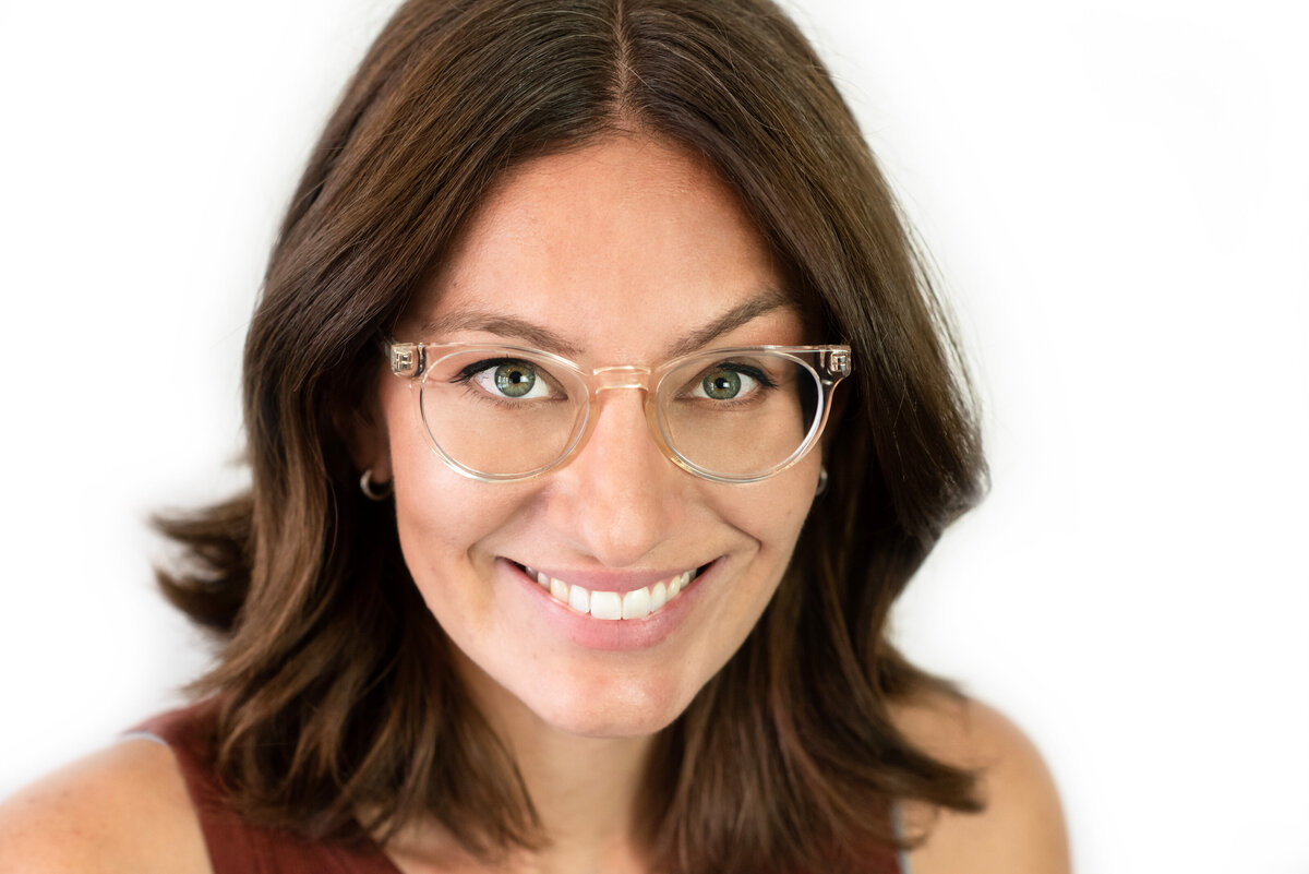 A woman smiling while looking up