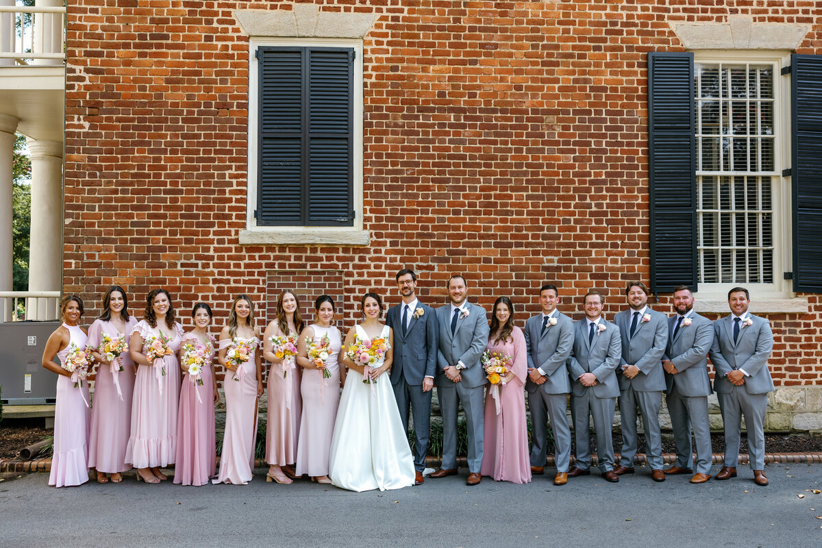 Bride and groom with bridesmaids and groomsmen, group photo at Market Hall Raleigh