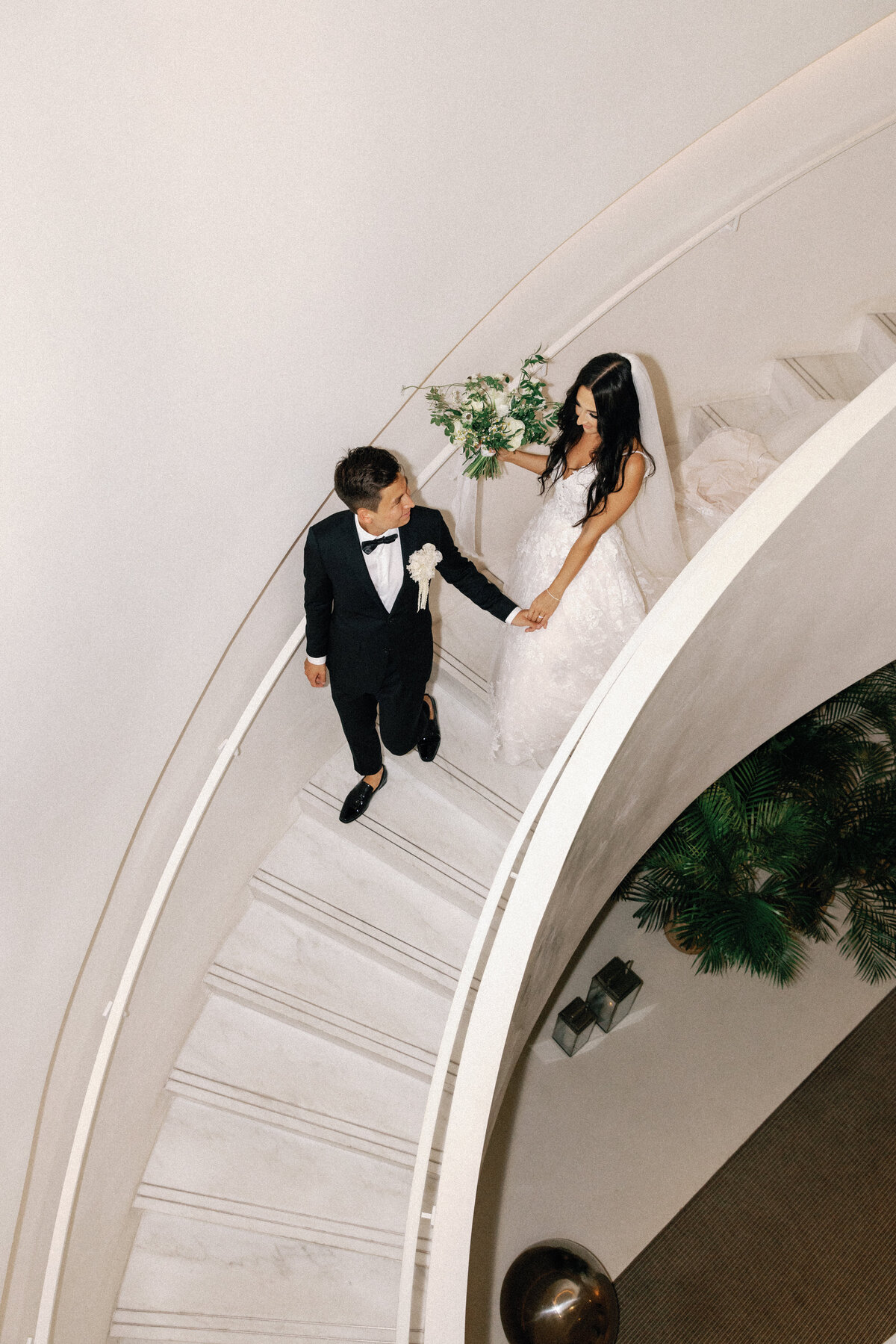modern bride and groom on staircase