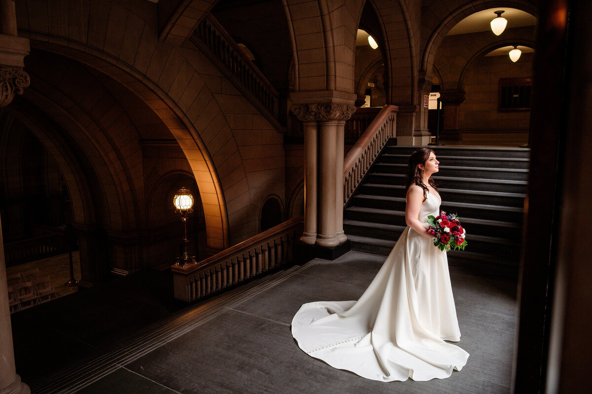 bride posing for wedding photo in allegheny county courthouse