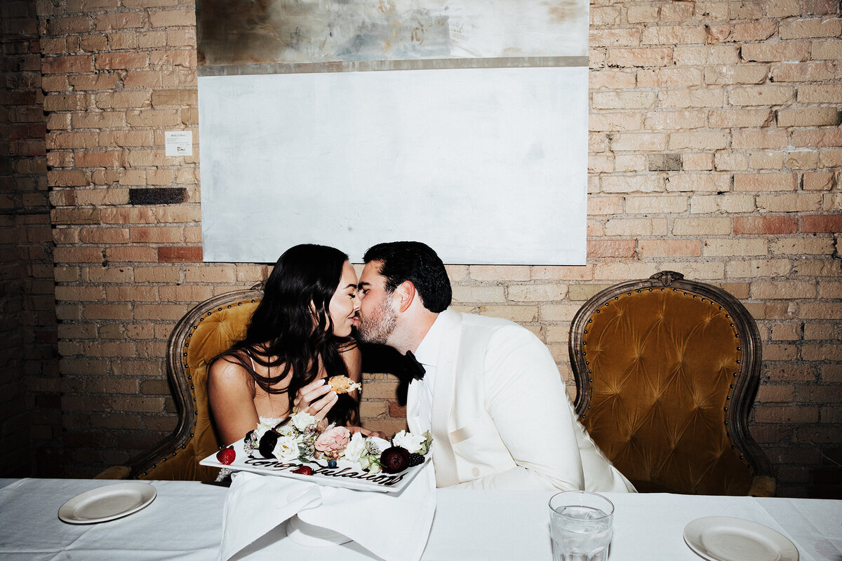 bride-kissing-groom-at-reception