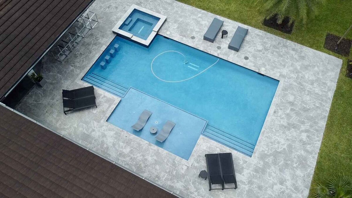 Swimming pool and spa with tanning ledge