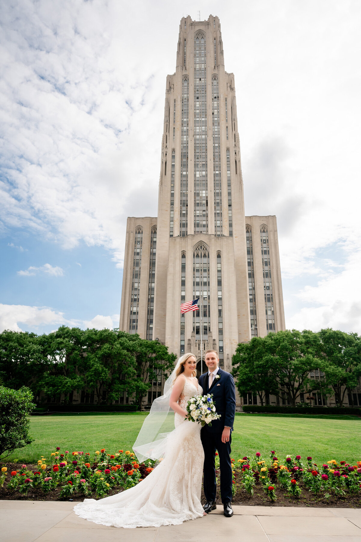 wedding photo of a pitt couple with the cathedral of learning