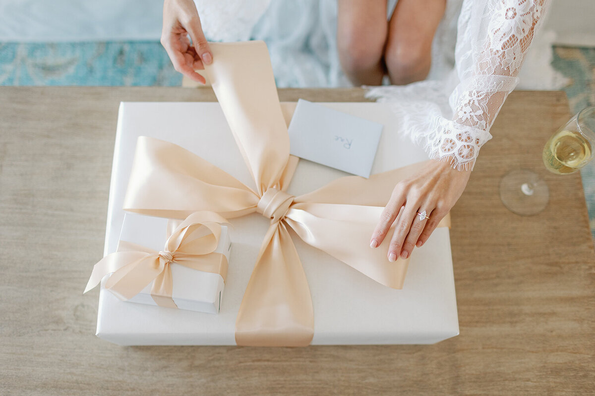 A bride opens up a wedding present.