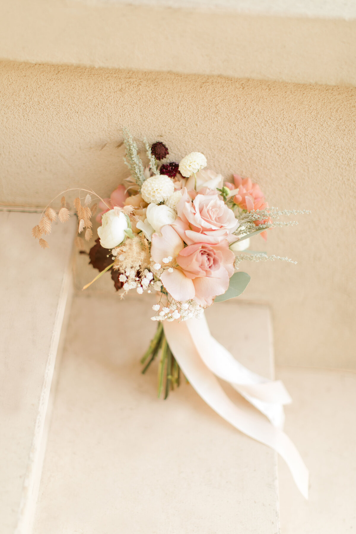 wedding bouquet with mauve burgundy white flowers