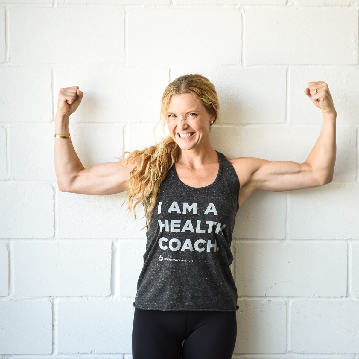 A professional business branding photographer near me capturing a strong health coach showcasing confidence in her portrait.